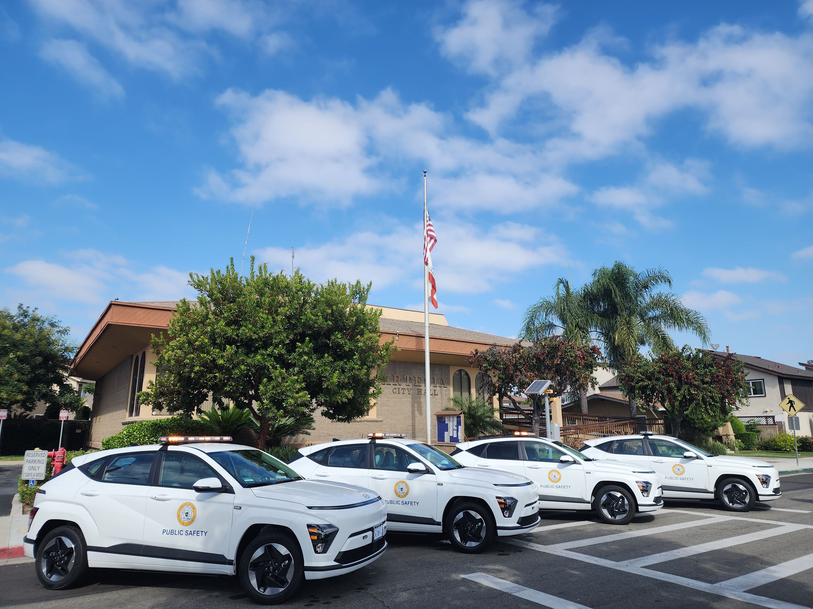 Electric Kona vehicles parked infront of Artesia City Hall 